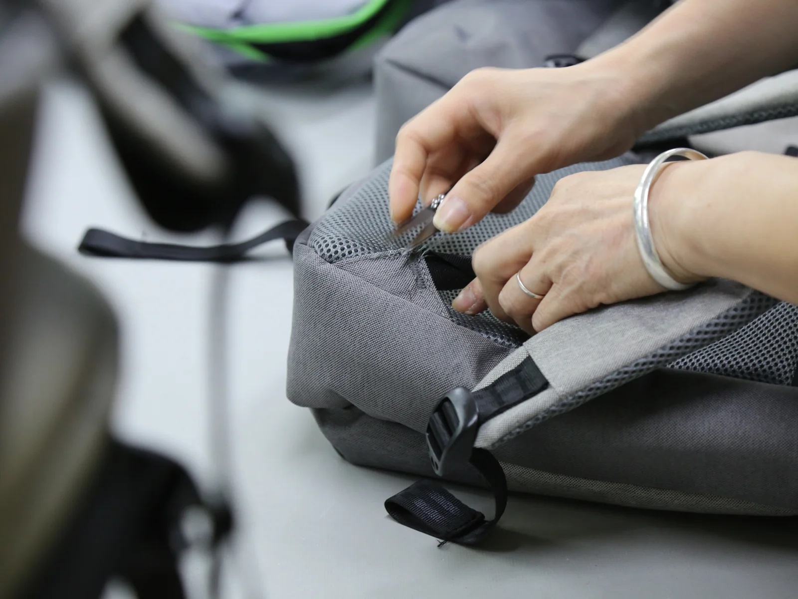 Weierken quality team inspecting the workmanship of a finished bag