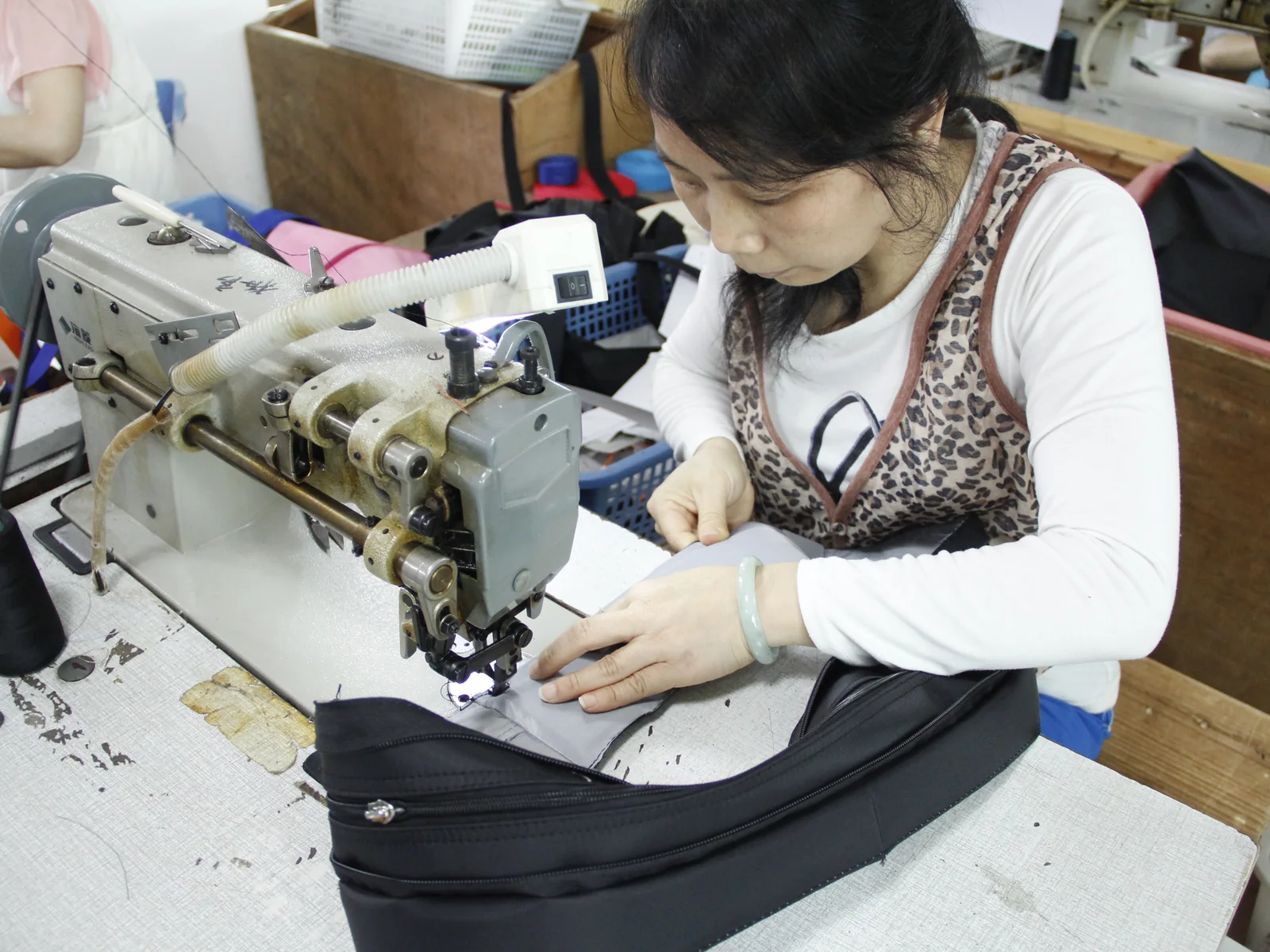 Bag sewing detail checked during production